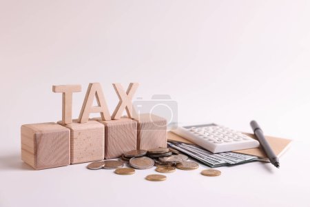 Word Tax, number 2024 made of wooden cubes, calculator, coins and banknotes on white background