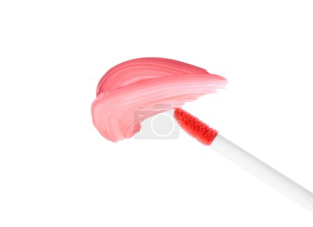 Foto de Trazos de brillo de labios de color y aplicador aislado en blanco, vista superior - Imagen libre de derechos