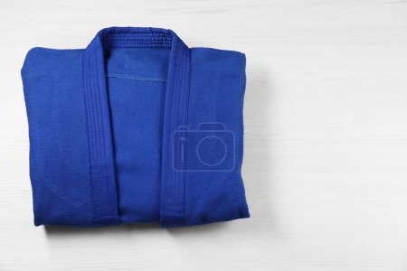 Photo for Blue kimono on wooden background, top view. Space for text - Royalty Free Image