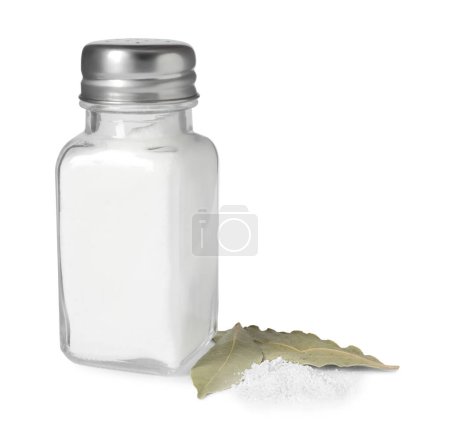 Salt shaker and bay leaves isolated on white