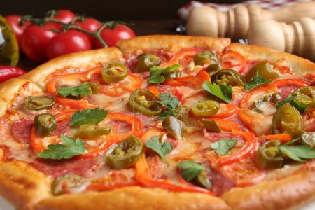 Delicious hot pizza Diablo on table, closeup