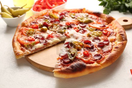 Delicious pizza Diablo on white textured table, closeup