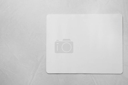 Photo for One mouse pad on grey textured table, top view. Space for text - Royalty Free Image
