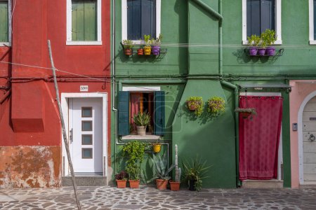 Photo for Burano, Italy - August 9, 2023; Detail   of colorful Venetian houses at the Islands of Burano in Venice - A fantastic travel destination - Royalty Free Image