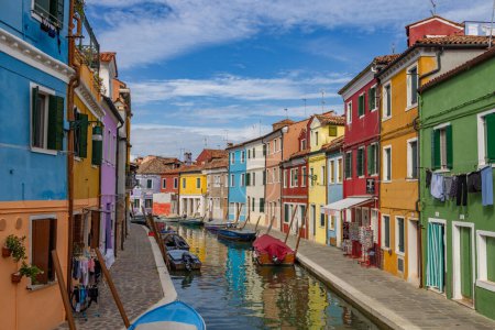 Photo for Burano, Italy - August 9, 2023; View of colorful Venetian houses along the canal at the Islands of Burano in Venice - A fantastic travel destination - Royalty Free Image