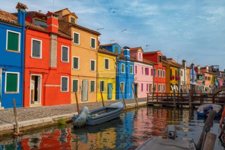 Photo for Burano, Italy - August 9, 2023; View of colorful Venetian houses along the canal at the Islands of Burano in Venice - A fantastic travel destination - Royalty Free Image