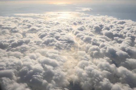 Photo for Clouds, sunlight during the day, taken from an airplane. - Royalty Free Image