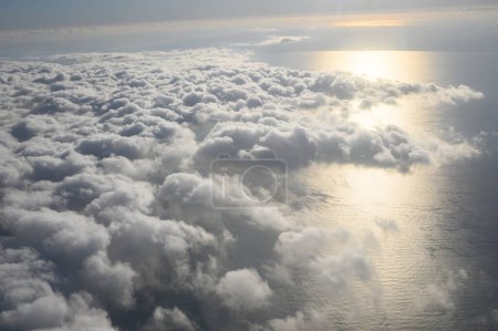 Photo for Clouds, sunlight during the day, taken from an airplane. - Royalty Free Image