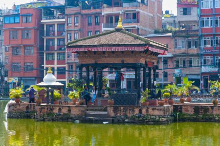 Photo for Patan, Lalitpur, Nepal - October 12, 2023 : Pimbahal Pukhu Pond Temple in Patan City of Nepal - Royalty Free Image