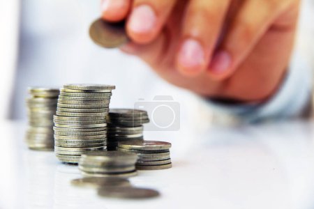 Photo for Image of Hand put coin to stack, investment concept - Royalty Free Image