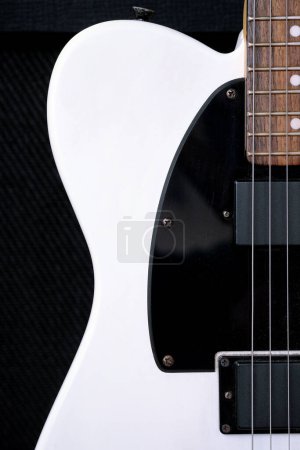 Photo for Electric guitar on the background of the guitar amplifier. Close-up. - Royalty Free Image