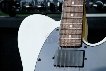 Photo for Electric guitar on the background of a guitar amplifier. Musical instrument. - Royalty Free Image