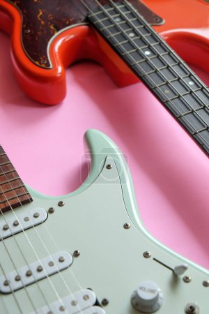Photo for Electric guitar and bass guitar on a pink background with copy space. - Royalty Free Image