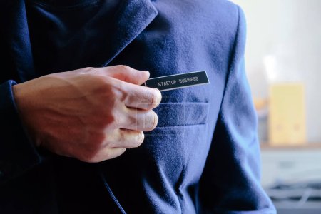 Photo for Businessman holding a startup business label in his hand, business concept - Royalty Free Image