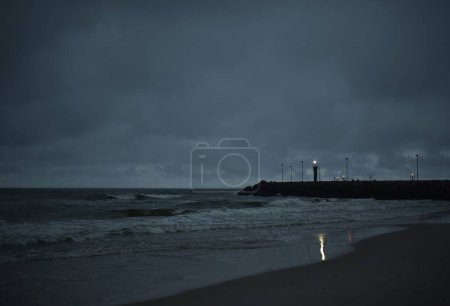 lighthouse near the town of Lba Baltic sea Poland. Night shot of the pier and the sea