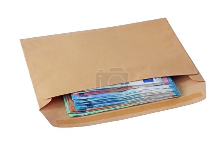 Photo for Isolated brown envelope with used Euro  notes. - Royalty Free Image