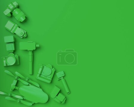Photo for Top view of designer workspace and gear like nonexistent DSLR camera, mobile phone, drone and action camera on selfie stick on monochrome background. 3d rendering of accessories for live streaming - Royalty Free Image