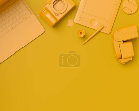 Top view of gold designer workspace and gear like laptop, tablet, digital camera and spidlight flash on monochrome background. 3d rendering of accessories for illustrator and photography tools