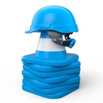Stack of safety helmets or hard hats and traffic cones for under construction road work on white background. 3d render carpentry tools for industrial worker and handyman