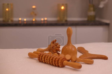 Wooden massage therapy tools on spa salon massaging table, anti cellulite health care concept