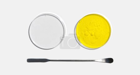 Photo for Potassium Chromate Powder in Petri dish with plastic lid placed next to the stainless spatula on laboratory table. - Royalty Free Image