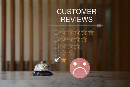 Customer Experience dissatisfied Concept, silver service bell on hotel reception desk with Sadness Emotion Face, Bad review, bad service dislike bad quality, low rating, social media not good.