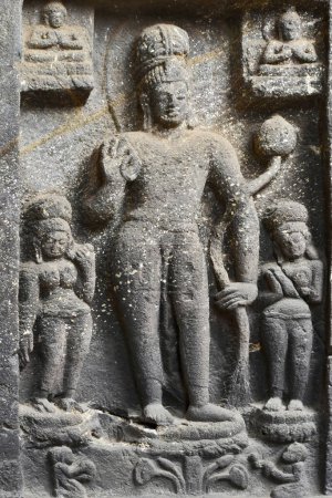 Photo for Buddhism Avalokitesvara Sculpture in middle at the entrance of Chaitya hall, Karla Caves, these Caves was constructed between 50 and 70 CE, and 120 CE, located near the Karla, Lonavala in Pune Dist. Maharashtra, India. - Royalty Free Image