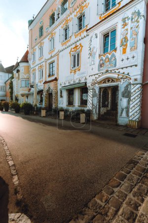 Photo for An empty street is lined with beuatiful buildings in Mauthausen - Royalty Free Image