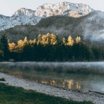 A majestic mountain landscape in the Austrian Alps. Misty morning over Langbathseen lake.