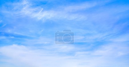 Photo for Bright blue sky with fine cirrus clouds, abstract nature background. - Royalty Free Image