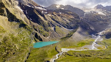 Aerial view of blue lake, austrian stubai alps, summertime