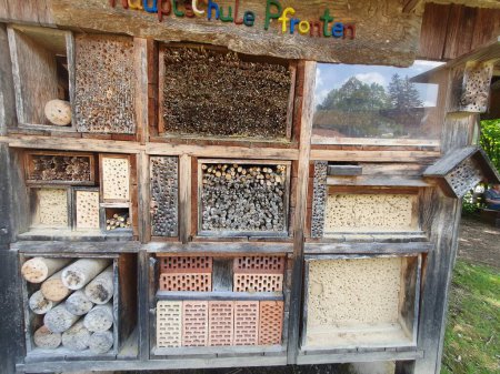 Bug hotel close up. Wooden eco materials for insects