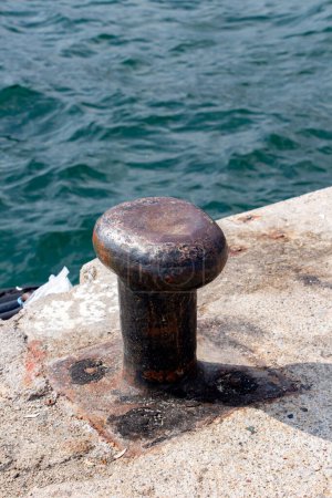 Photo for Mooring bollards on the quay of the sea.  Rusty mooring bollard on the dock of the sea - Royalty Free Image