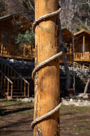 Rope tied to a wooden pole in the courtyard of the house