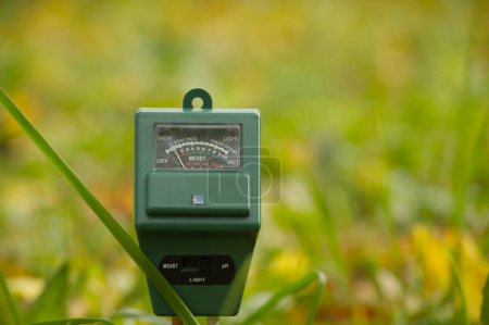 Agricultural meter in close up over blurred background. High technology agriculture concept