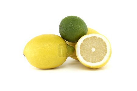 Vibrant yellow lemons and the green lime creating a bright and vivid visual contrast isolated on white background