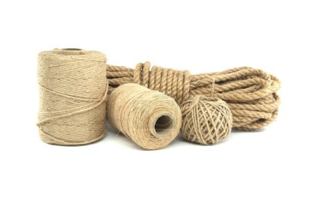 Photo for Spools of natural fiber rope presented with varying thicknesses isolated on white background - Royalty Free Image