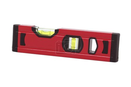 Red spirit level with a green bubble indicator is situated horizontally on a white background