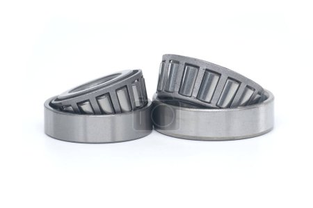 Single row tapered roller bearings isolated on white background. Spare parts for machinery and automotive industry
