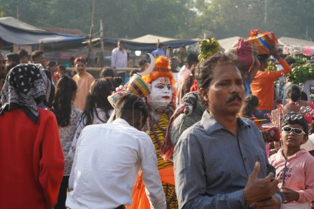 Photo for 31st October 2022, Kolkata, West Bengal, India. Crowd during chhath Puja and Spotted Lord Shiva Bahurupi at Babu Ghat - Royalty Free Image