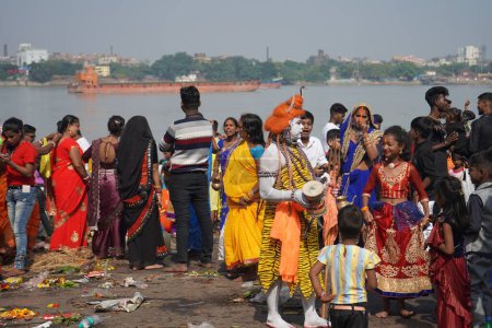 Photo for 31st October 2022, Kolkata, West Bengal, India. People enjoying the performance of Lord Shiva Bahurupi at Babu Ghat - Royalty Free Image