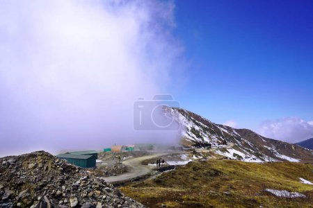 Photo for Cloud Stuck in snow capped Himalayan mountain in Sikkim silk route - Royalty Free Image