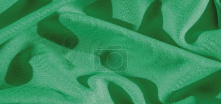Foto de Seda verde. Liso elegante tela de seda de lujo verde se puede utilizar como fondo abstracto con espacio de copia, de cerca. textura colorida - Imagen libre de derechos