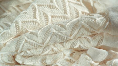 Photo for Texture, background, pattern, silk fabric, layered lace tulle, premium plain winter diamond knit scarf in the form of infinity loops - white - Royalty Free Image