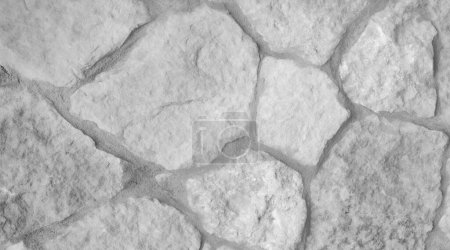 Fondo borroso. La textura de la piedra incrustada en la pared, blanco