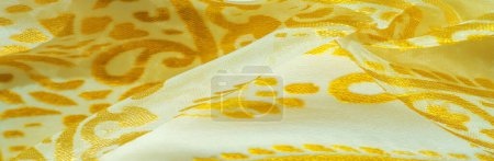 Silk fabric, golden pastels of delicate exquisite colors on a white background, Printed golden paisley photograph.