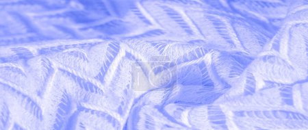 blauer Stoff, mehrlagige Seidenspitze, durchgefärbtes, winterlich gestricktes Premium-Tuch. Textur, Hintergrund, Muster, Seide