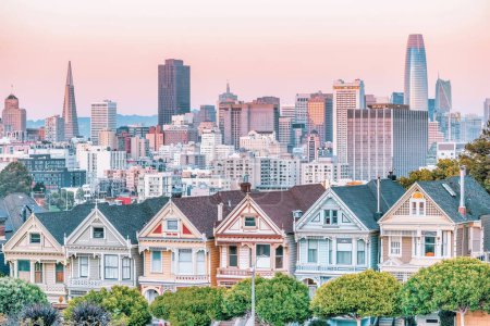 Photo for Painted Ladies Victorian houses in Alamo Square and a view of the San Francisco skyline and skyscrapers. Photo processed, in pastel colors - Royalty Free Image