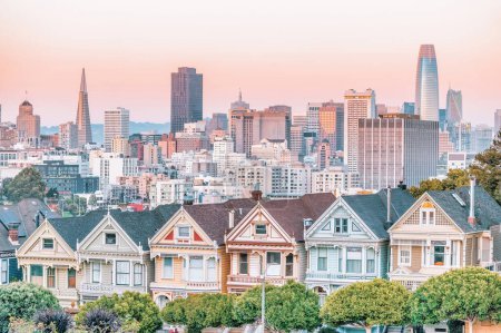 Photo for Painted Ladies Victorian houses in Alamo Square and a view of the San Francisco skyline and skyscrapers. Photo processed, in pastel colors - Royalty Free Image