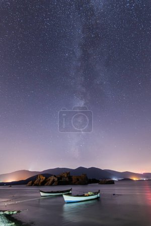 Photo for A view of the stars of the Milky Way with a mountain top in the foreground. Night sky nature summer landscape. Perseid Meteor Shower observation - Royalty Free Image